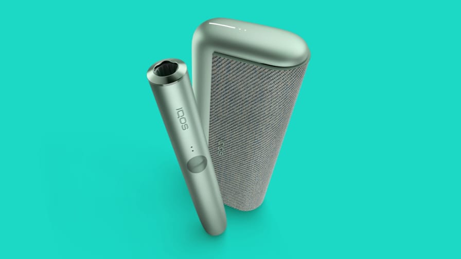 A jade green IQOS ILUMA PRIME Pocket Charger and Holder.